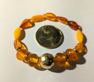 Genuine amber elastic bracelet with gold plated sterling silver beads
