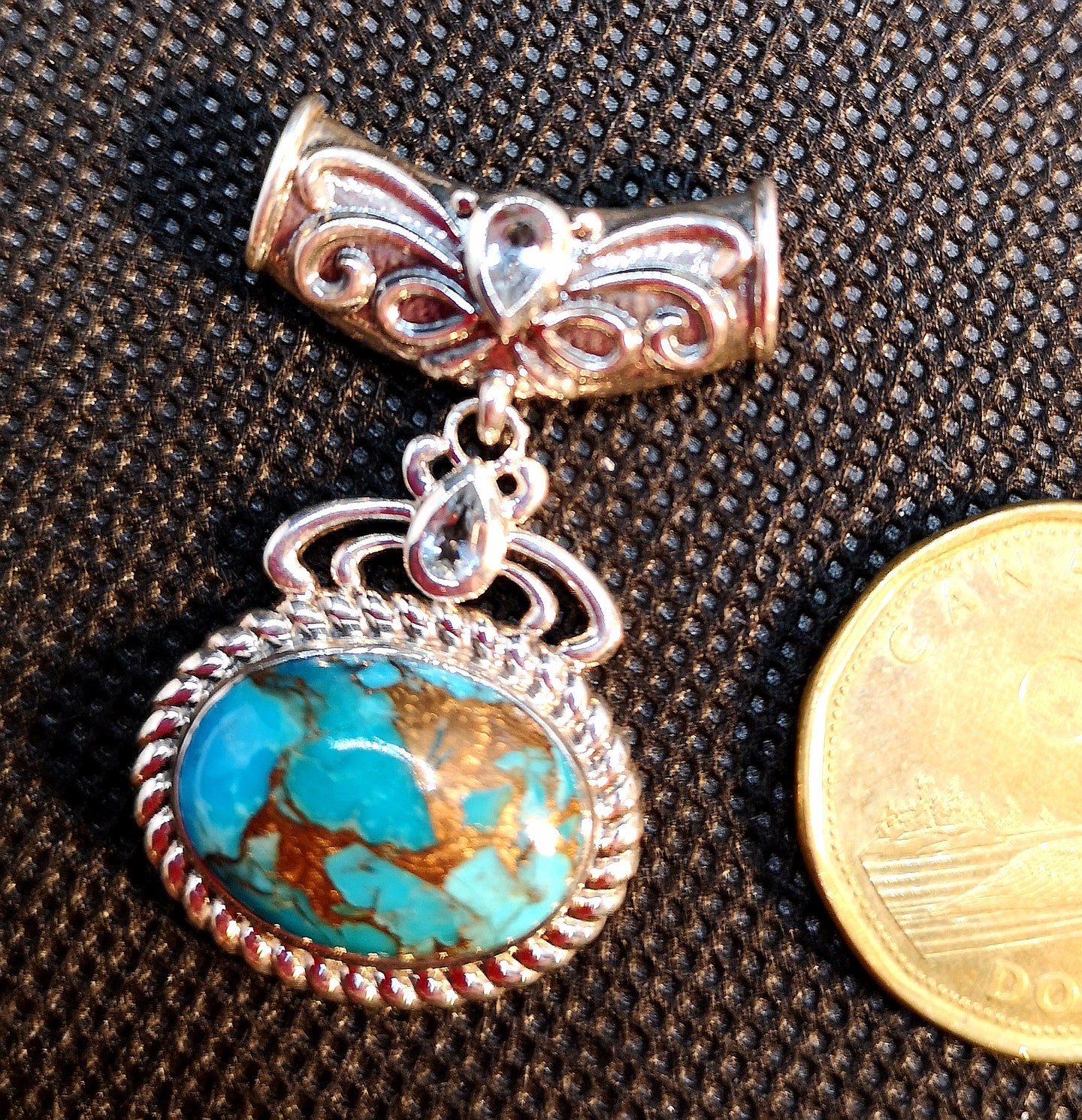 Genuine turquoise with copper inclusions, pendant in sterling silver with blue topaz