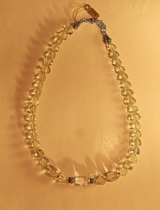 Green amethyst faceted stone necklace with sterling silver beads and extending chain.