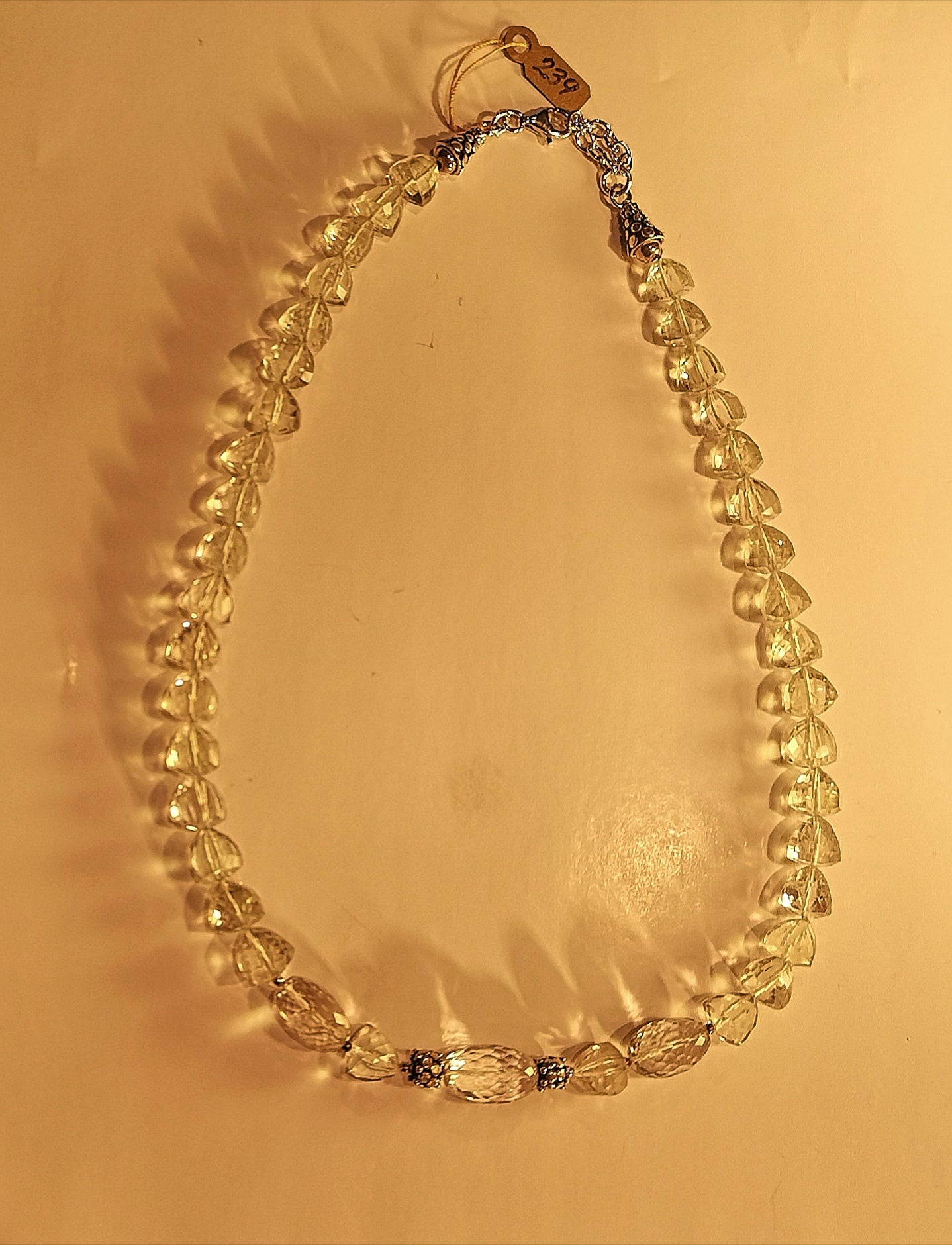 Green amethyst faceted stone necklace with sterling silver beads and extending chain.
