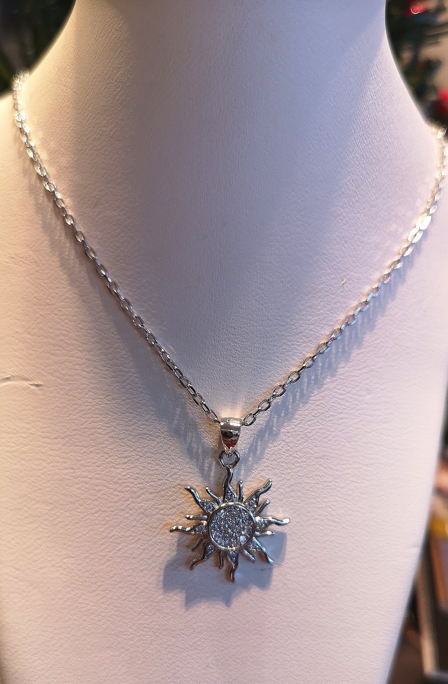 Sterling silver with rhodium finish and cubic sun necklace