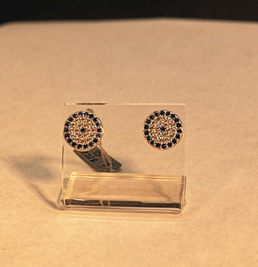 Micro-set cubic evil eye studs in sterling silver with rhodium finish