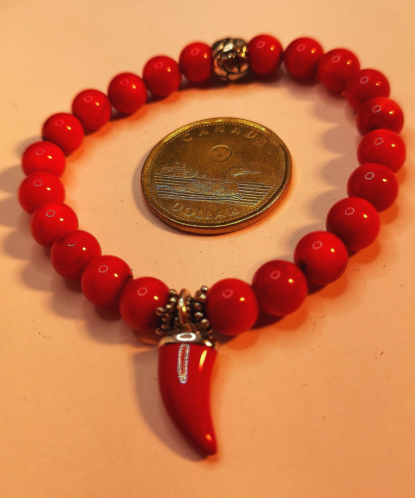 Sea bamboo coral elastic bracelet with sterling silver red enamel horn of luck and bead