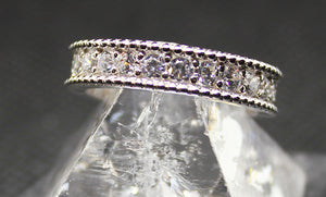 5mm wide eternity ring, sterling silver with rhodium finish.