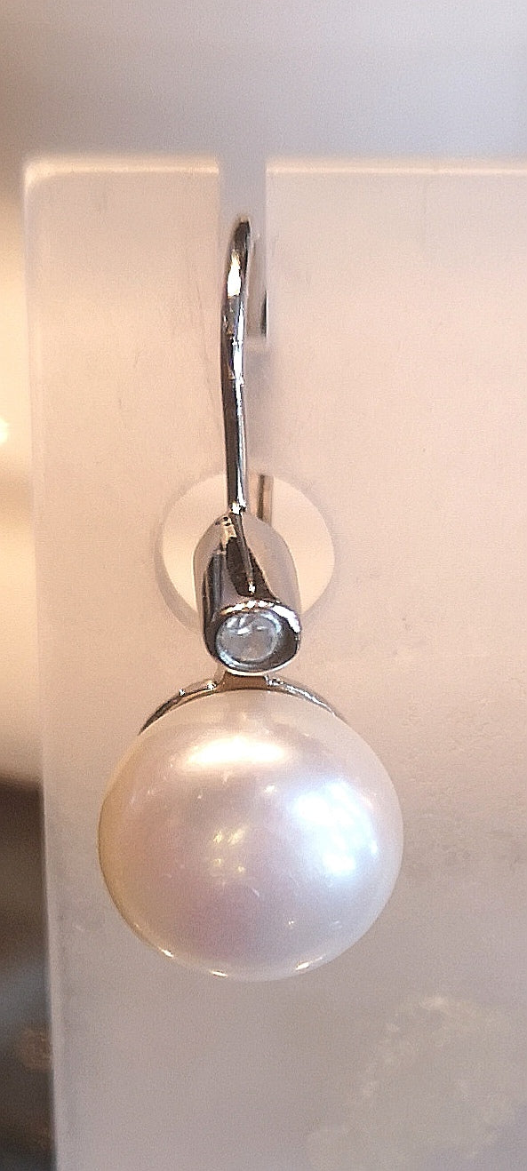 Genuine pearl hinge back earring in sterling silver with rhodium finish and cubic
