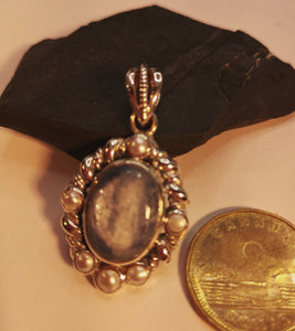 Kyanite pendant with genuine inlaid pearls in sterling silver.