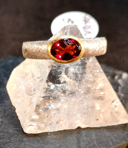 Genuine garnet ring in sterling silver with gold accented bezel