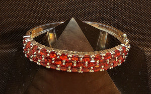 Garnet cuff bracelet with hinge opening in sterling silver