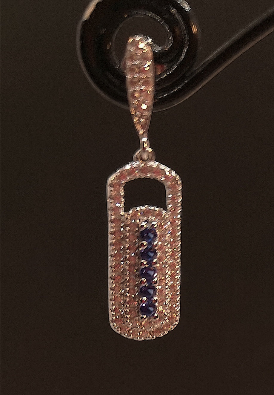 Sterling silver earring with rhodium finish and blue sapphire look cubic