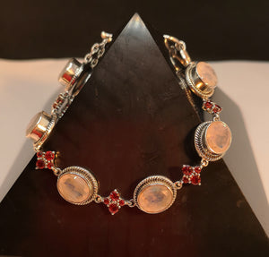 Rainbow moonstone with garnet bracelet in sterling silver, toggle closure